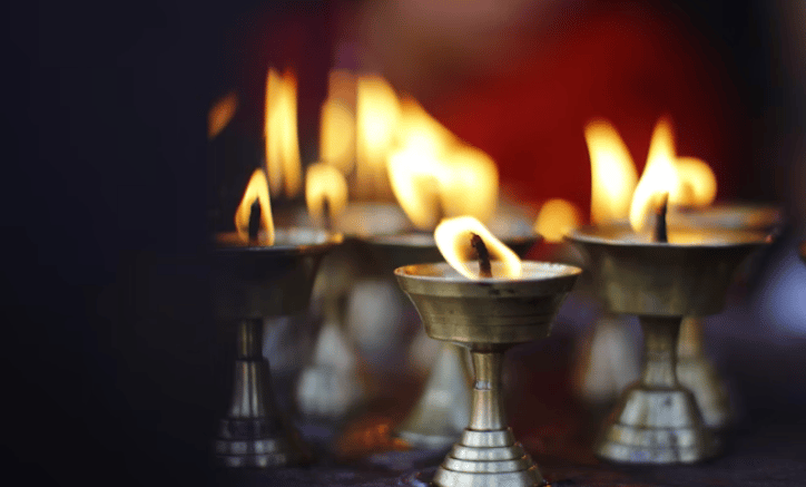 a group of candles with candles in a row