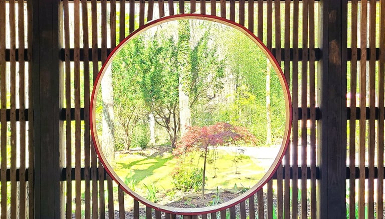 Huntsville, AL - A round window inside the Japanese Tea House frames the scenery outside