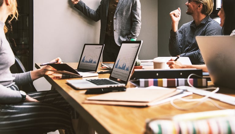 group of people in a business meeting representing gold ira for small businesses