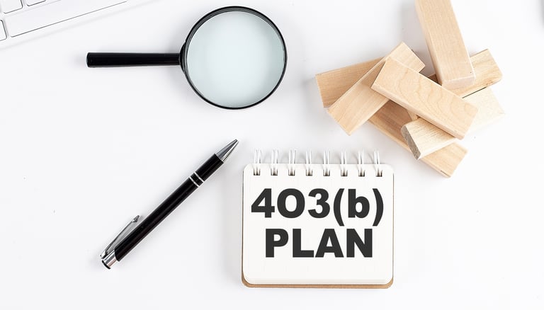 magnifying glass a pen and blocks for 403b plans