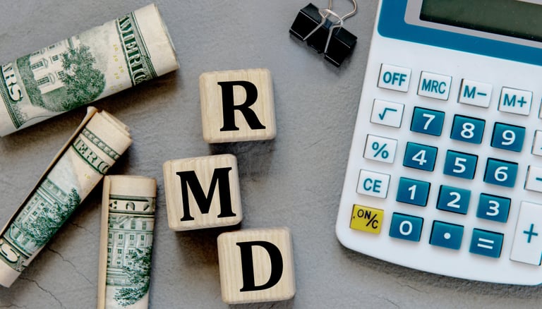 a calculator paperclip and money for required minimum distributions