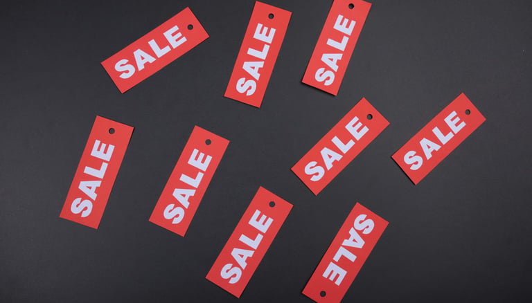 for sale labels symbolizing value investing