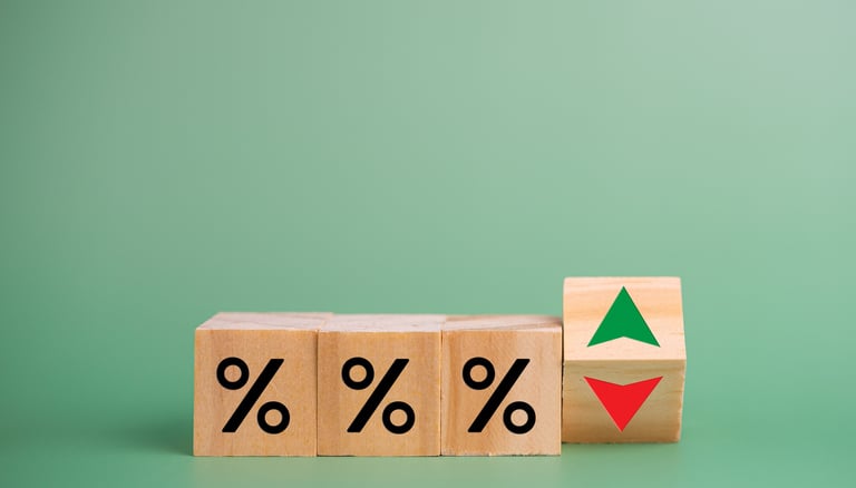 interest rate symbols with a red arrow going down for rate cuts