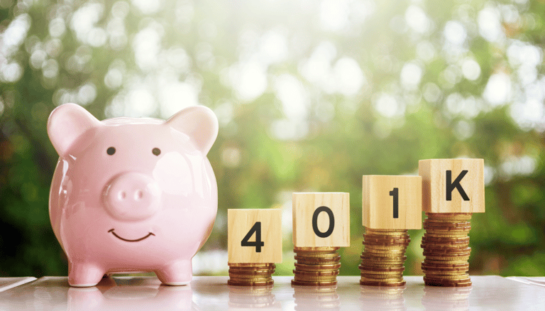 piggy bank and 401k blocks on gold coins