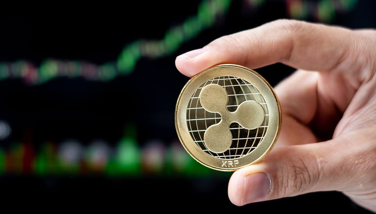 ripple xrp token in someones hands with charts in background