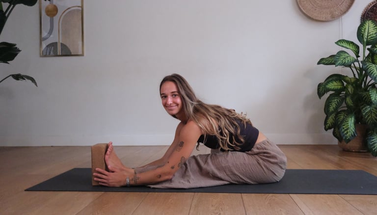 Yoga teacher Jean demonstrating a seating stretch