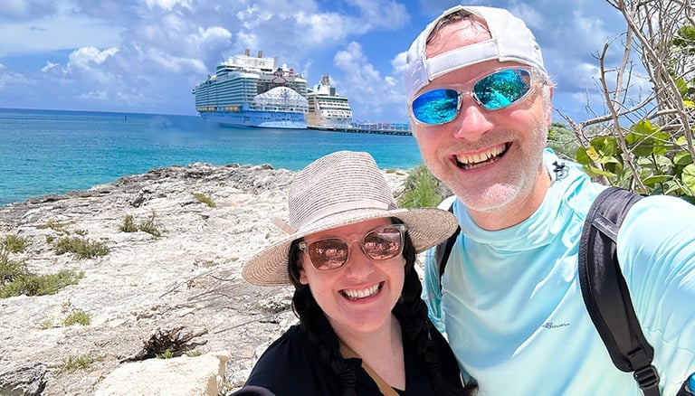 Minnie's Travel Boutique owners Chris and Kristen Breedlove pictured in front of Utopia of the Seas.