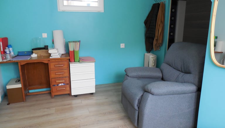 a chair with a chair and a desk with a mirror