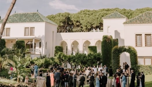 Garden event at Villa El Rincon with guests gathered among lush greenery