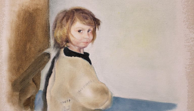 Young girl with mousy coloured bobbed hair. Dark blue top with Cardigan on top looks at viewer.