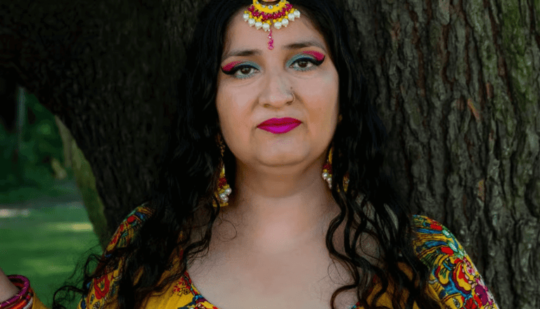 Satnam Galsian in a yellow dress, director of daz in the hat radio