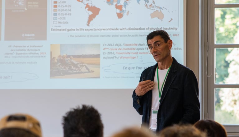 a man standing in front of a presentation on a presentation