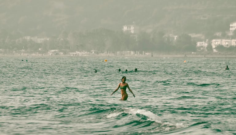 Albania beaches, digital nomad Europe, woman in ocean, remote-friendly destinations