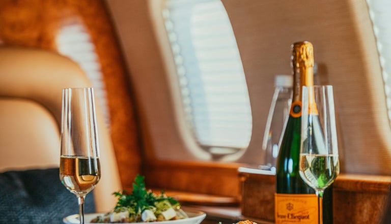 a table with a bottle of champagne and a bottle of wine