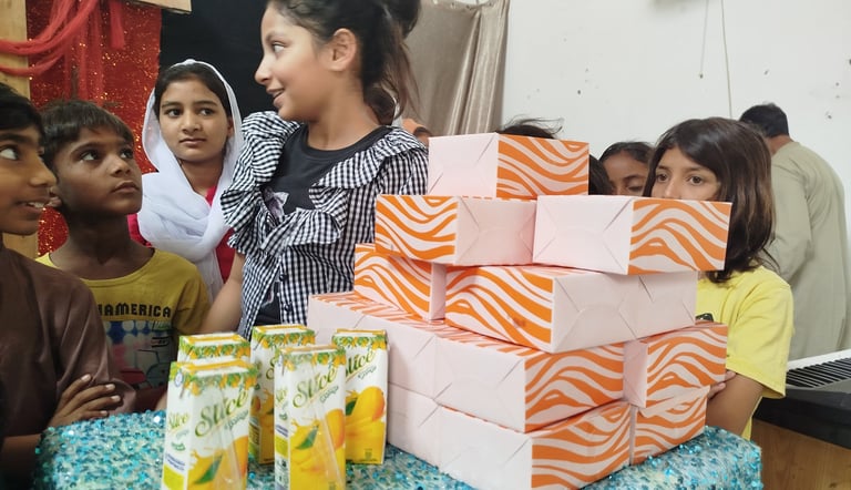 Abigail Amir Fazal distributing food and drinks to Sunday School children