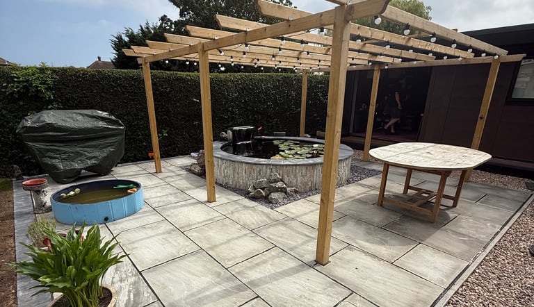 round raised pond paving & pergola garden ponds