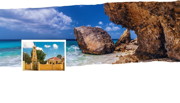 Vista de Kralendijk com praia ao fundo e o centro colorido em destaque.