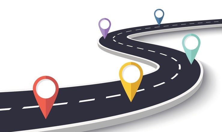 a winding road with pinpoint markers and pinstripes