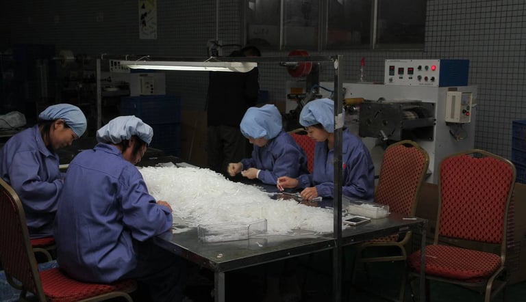The workshop team is collaborating to complete production tasks