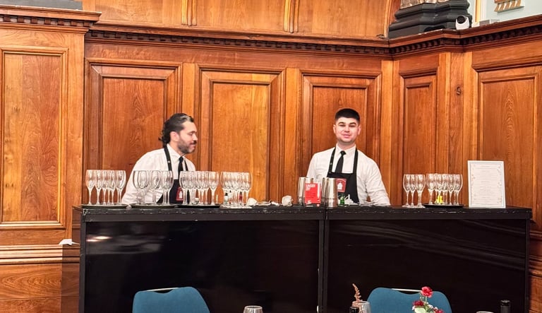 Professional bartenders serving drinks at wedding bar hire London
