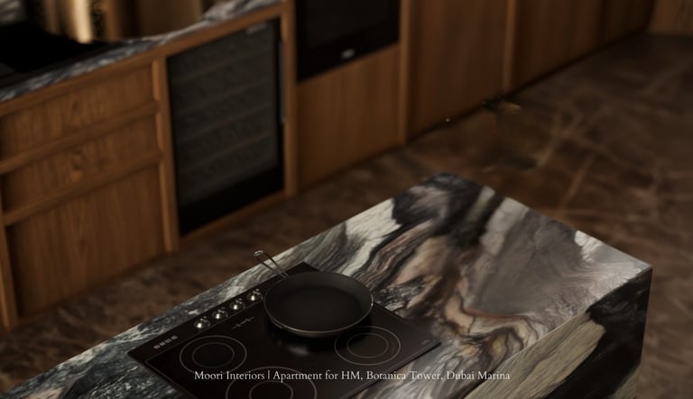 Modern kitchen island with marble top, induction cooktop, and pan. Wood cabinets in background.