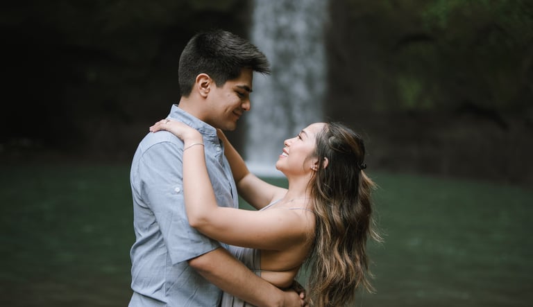 Intimate lift embrace prewedding moment at Tibumana Waterfall Bangli Bali