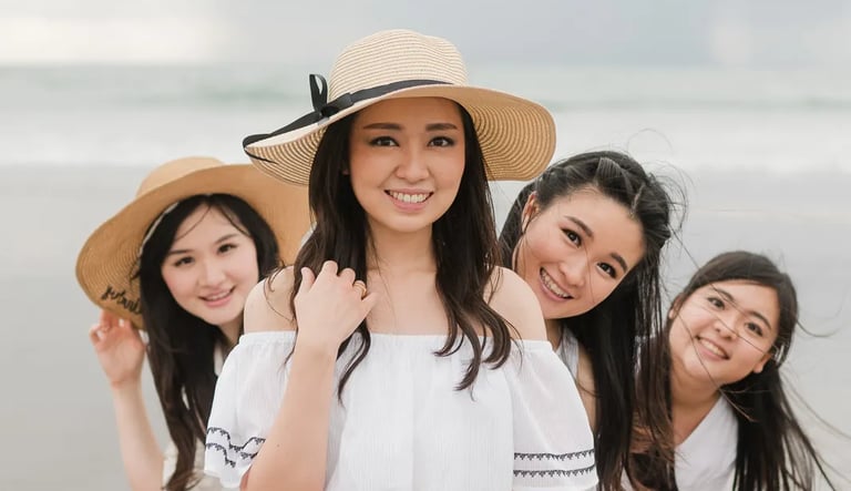 Multigeneration family portrait at Seminyak Beach Bali with joyful natural interaction during sunset family session.