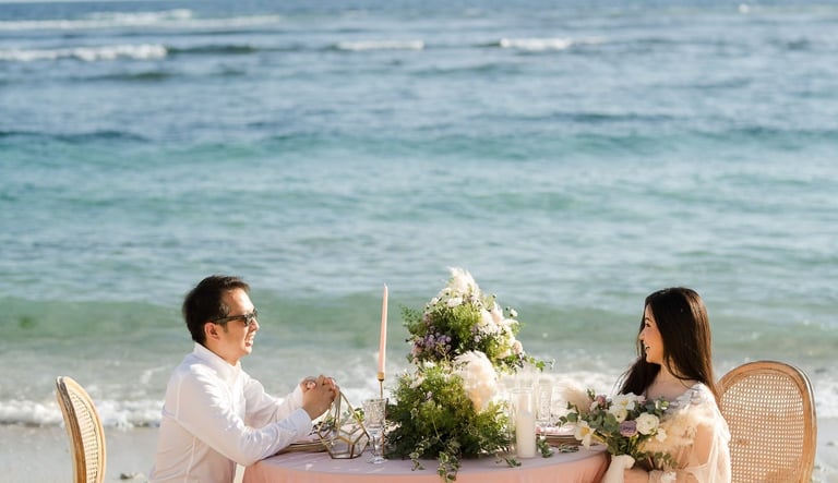 Luxury prewedding couple romantic beach dining at Melasti Beach Ungasan Bali