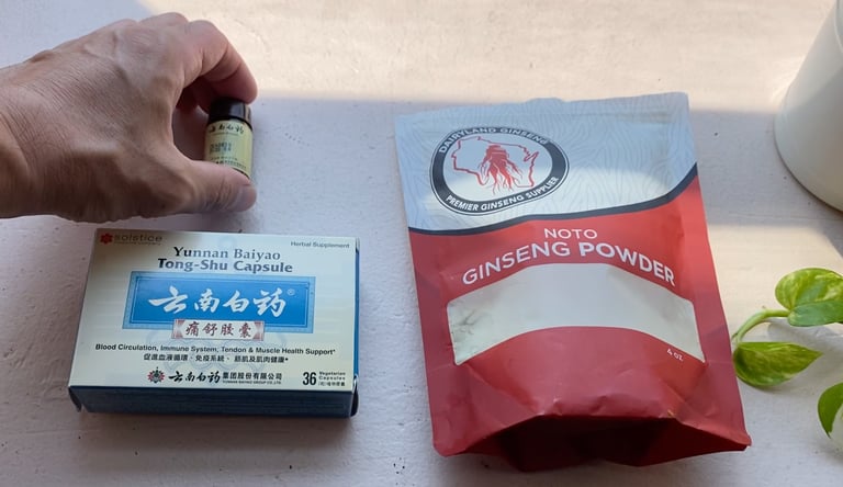 a person holding a bottle of notogingseng powder, with two other brands of same on windowsill