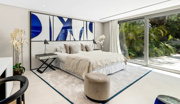 Contemporary bedroom with terrace views at Villa Serenity