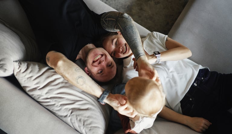 family cuddling at home in Geneva