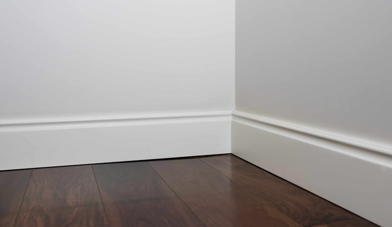 Clean baseboard corner installation with professional finish.