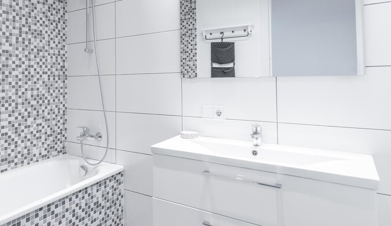 Ceramic tile flooring in a modern bathroom designed for durability and water resistance.
