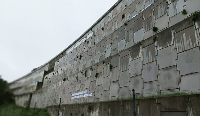 The motorway runs above this wall, Lodève