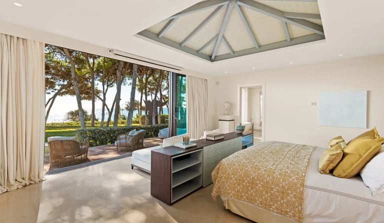 Bedroom at Villa El Rincon with canopy ceiling and sea views 