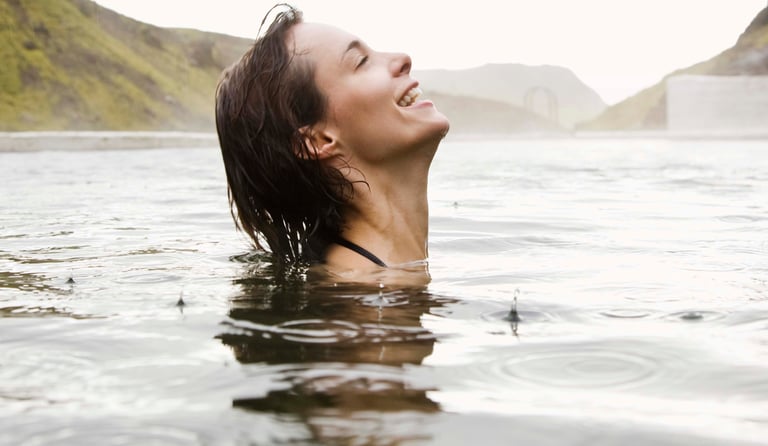 a woman bathing in Sultaniye Thermal Springs, one of the best places to visit in Dalyan