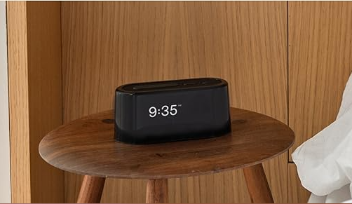 Black Loftie smart alarm clock with digital display.