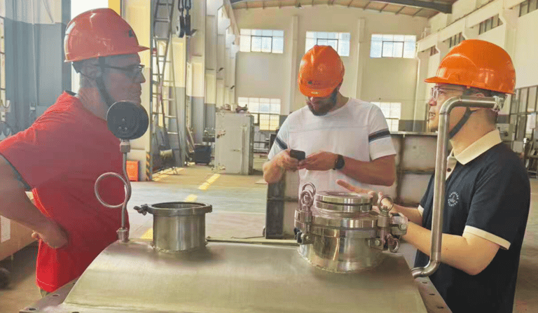 A foreign client conducting an onsite audit and factory tour at a paddle dryer manufacturing plant