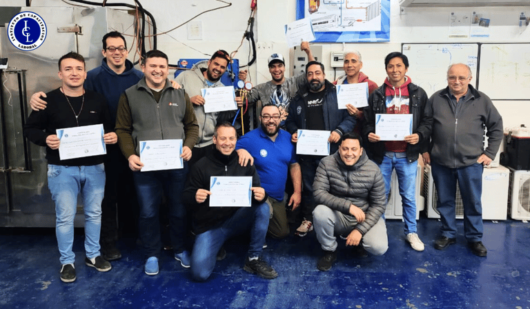 a group of people standing around a table with certificates