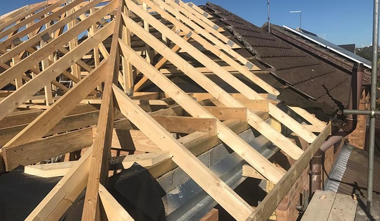 A total roof replacement including rafters, joists and beamjoists 