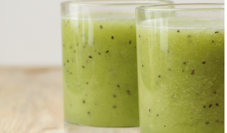 two glasses of kiwis with kiwis on them