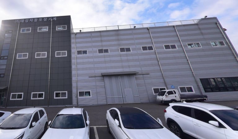 a group of cars parked in front of a building