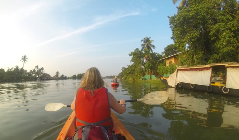 Tracey Billington canoeing on the waterway at Alappuzha, Kerala, India