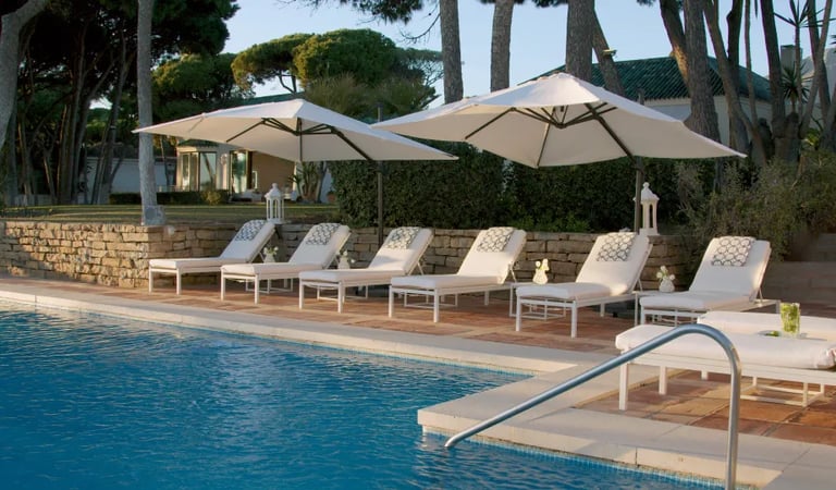 Sun loungers by the main pool at Villa El Rincon