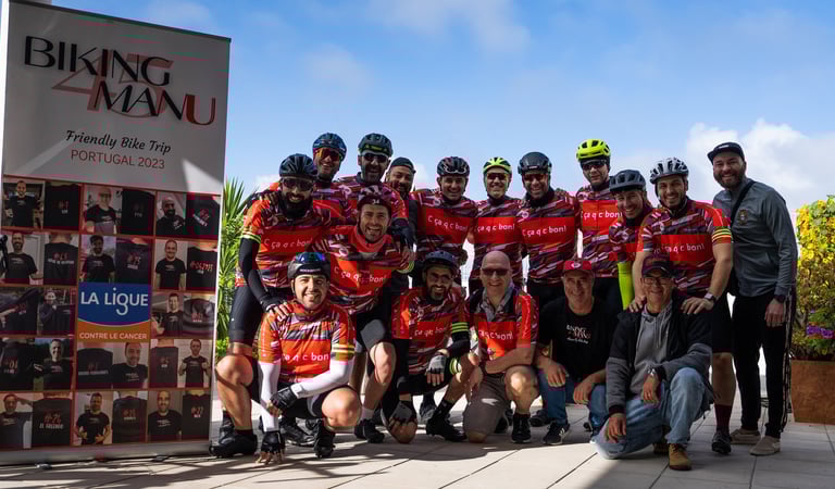 a group of people standing around a bike