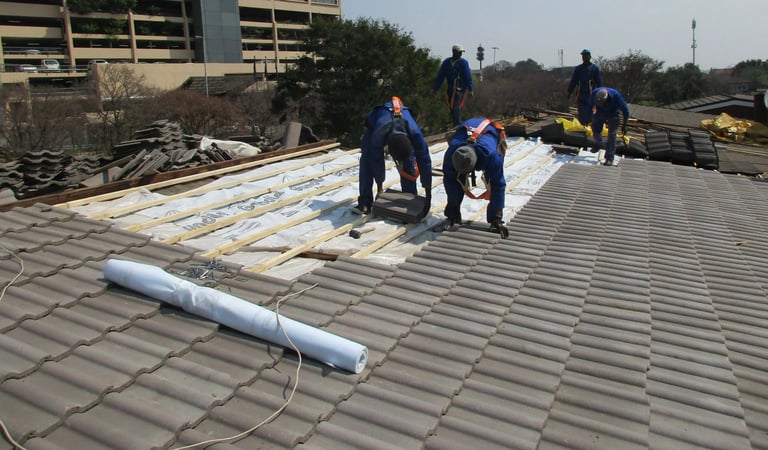 Laying roof tiles for roof installation Project, Environmental Pro Construction
