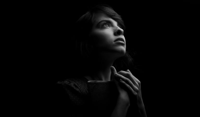 Woman seeking calm spiritual guidance and emotional support during a difficult experience