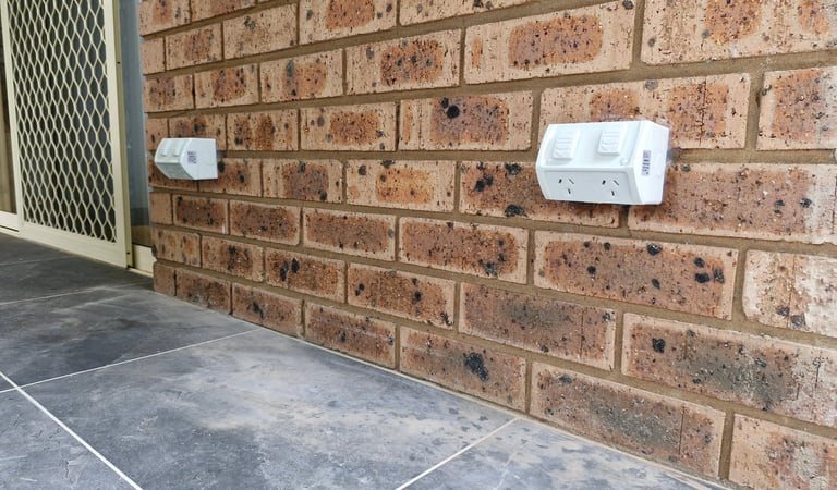 a close up photo of two weatherproof power points