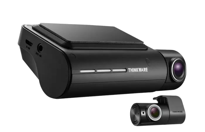 Thinkware Q850 front and rear dash cam system showing compact design and dual camera setup.