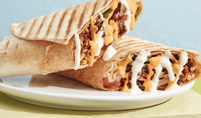 A promotional poster depicting a shawarma wrap and text that says "Hot Off the Press"